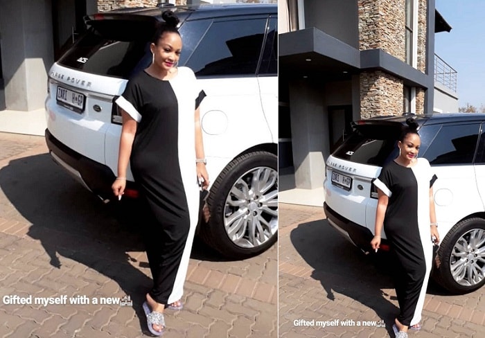 Zari next to her white rover sport and in the background is her latest house
